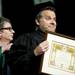 Executive Story Editor of the series "Dexter" and EMU Alumni Scott Reynolds receives a Doctor of Arts and Letters award after speaking at the Spring Commencement on Sunday, April 28. Daniel Brenner I AnnArbor.com